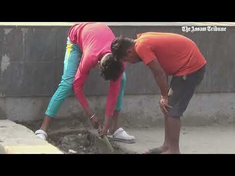 Sanitary workers cleaning drains sans safety gears