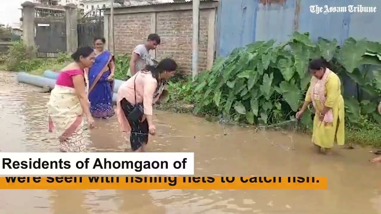 Guwahati: Locals in Garchuk go fishing on water-logged roads
