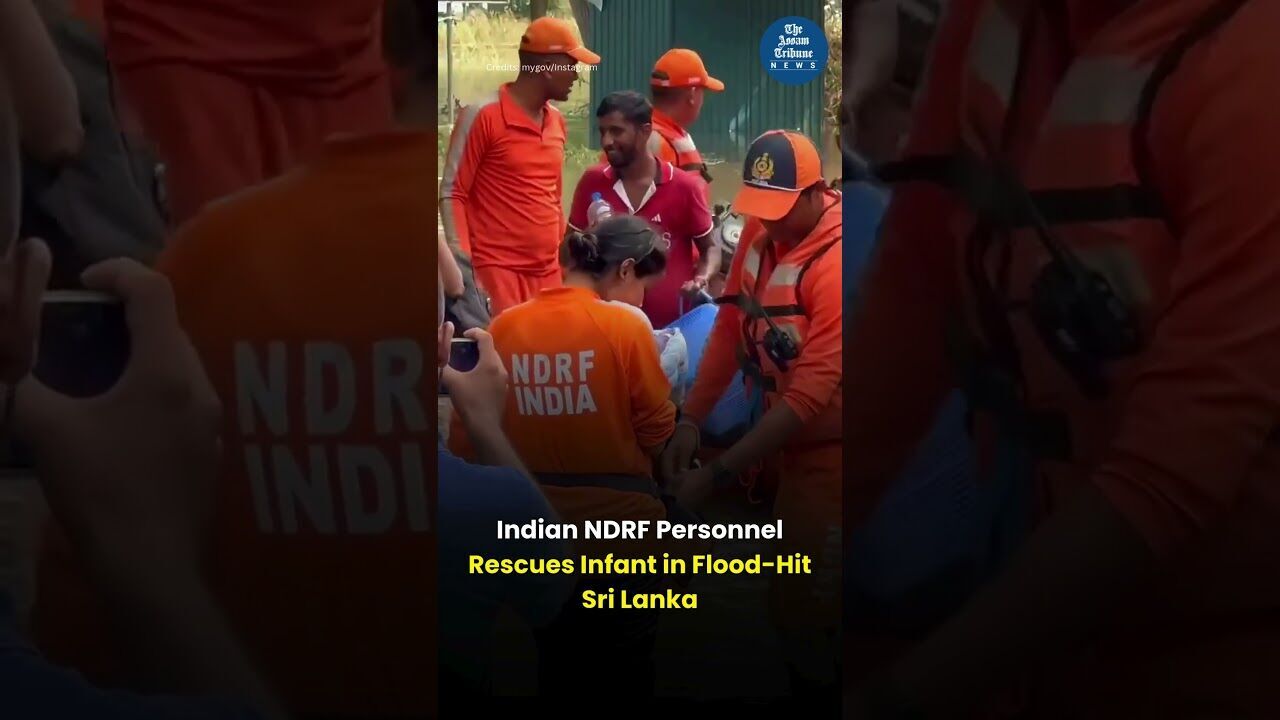 Indian NDRF Personnel  Rescues Infant in Flood Hit Sri Lanka